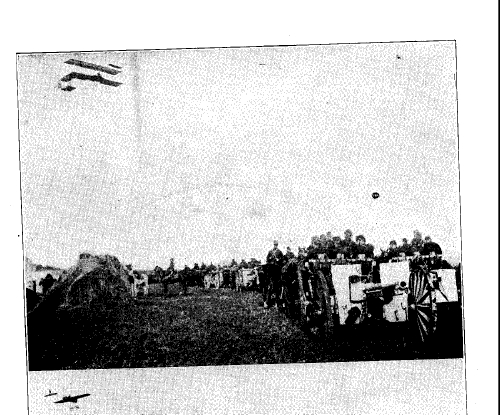 Photograph showing A German Plane serving as a spotter as column of German Artillery Advances on the Western Front. Source: Europe's Greatest War, published 1915 