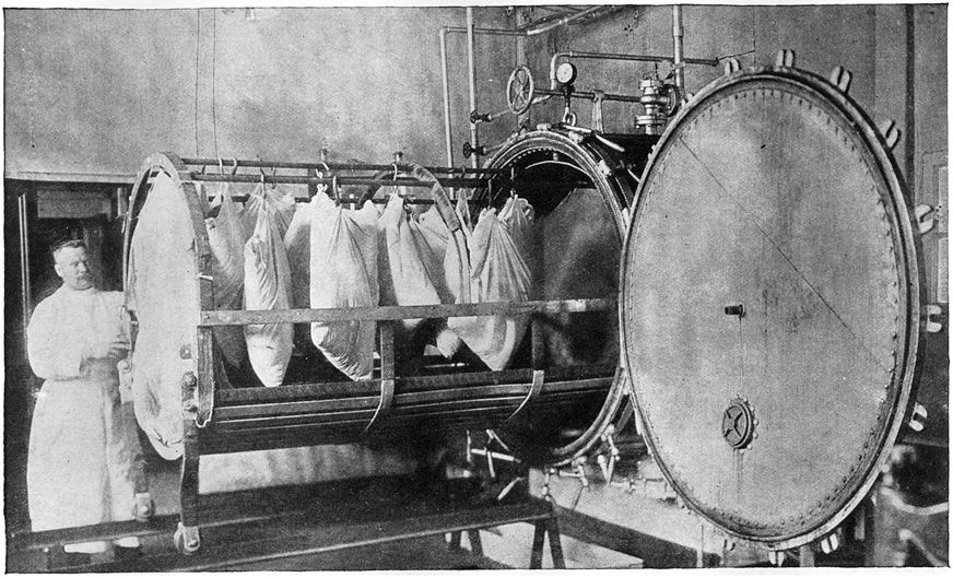 A disinfecting apparatus used in one of the large hospitals in Petrograd. Bags containing patients's clothing are inserted in a huge cylinder, where the disinfecting takes place. World War 1 Russia