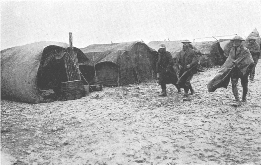 Home, Sweet Home - tents amid a muddy field.