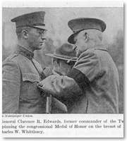 Major General Clarence R. Edwards pinning the congressional Medal of Honor on the breast of Lieutenant Colonel Charles W. Whittlesey. 