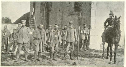 WOUNDED GERMAN PRISONERS OUTSIDE A CHURCH NEAR MEAUX