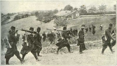 FRENCH SOLDIERS CARRYING A MACHINE GUN