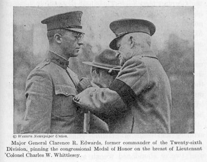 Major General Clarence R. Edwards pinning the congressional Medal of Honor on the breast of Lieutenant Colonel Charles W. Whittlesey. 
